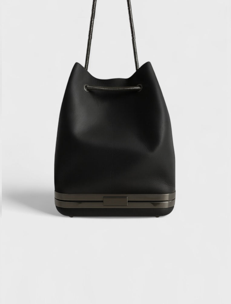 Kesmara Hulet Mini Drawstring Bag in black leather, quiet luxury crossbody with hidden clutch, a capsule wardrobe essential and luxury everyday bag made in New York.