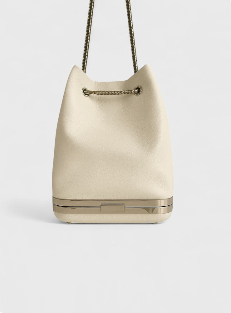 Kesmara Hulet Mini Drawstring Bag in ivory leather, quiet luxury crossbody with hidden clutch compartment, minimalist luxury everyday bag handcrafted in New York