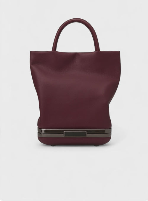 Kesmara Hulet Mini Tote in burgundy leather, quiet luxury mini tote and crossbody with hidden clutch compartment, handcrafted in New York, an investment handbag in a trending color.